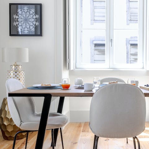 Start mornings with coffee and pastéis de nata at the bright dining table before setting off to explore the city