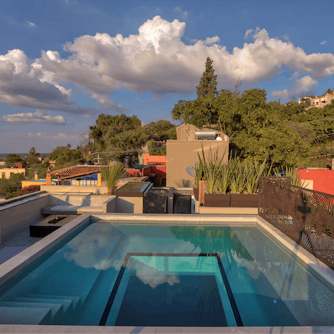 Unwind in an innovative, glass-bottom rooftop swimming pool