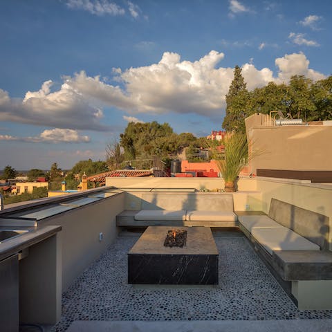 Share anecdotes over a glass of wine besides the black marble fireplace