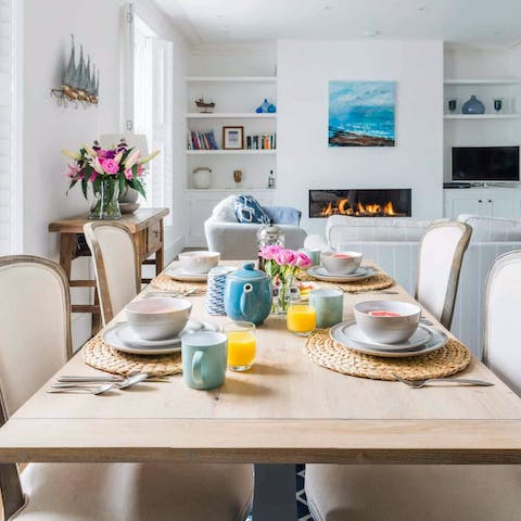 Gather for a meal while enjoying the glow of the living room's fire