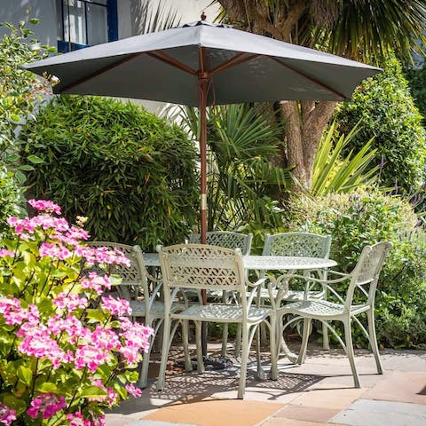 Enjoy a sundowner in the leafy communal garden