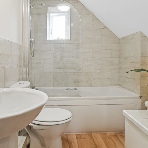 Tend to limbs sore from walking in the home's bathtub