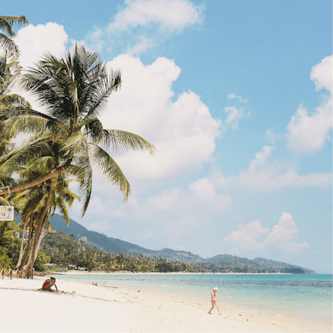 Stroll along the white sands of Choeng Mon Beach, a five-minute drive away
