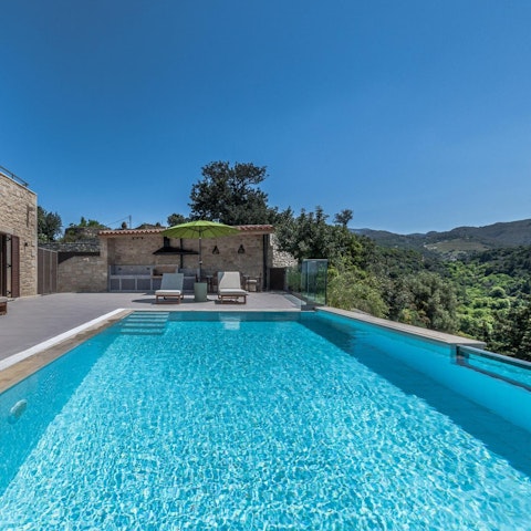 Cool off in the private pool and enjoy the verdant views