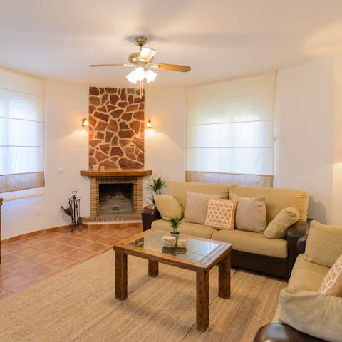 Light up the fireplace once the sun's gone down and cosy up besides the warmth