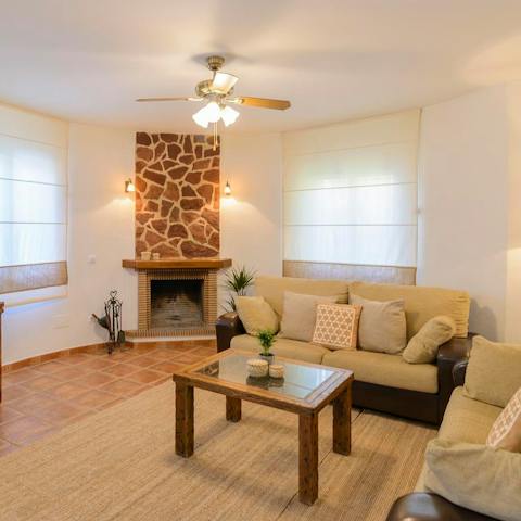 Light up the fireplace once the sun's gone down and cosy up besides the warmth