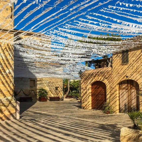 Enjoy a leisurely stroll through the atmospheric streets of Alcúdia's Old Town