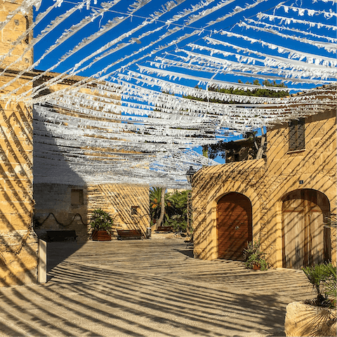 Enjoy a leisurely stroll through the atmospheric streets of Alcúdia's Old Town