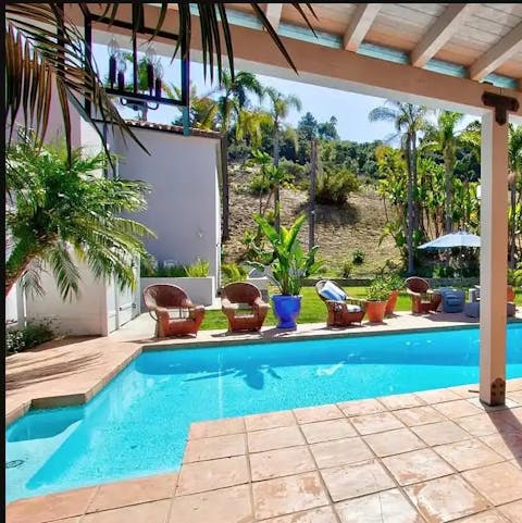 Slip into the turquoise water of the resort-style swimming pool