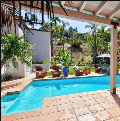 Slip into the turquoise water of the resort-style swimming pool