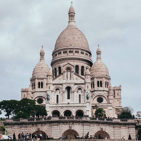 Jump on the metro and head over to the Sacré-Cœur Basilica