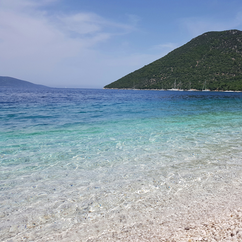 Drive over to Asos Beach and soak up the golden sunshine