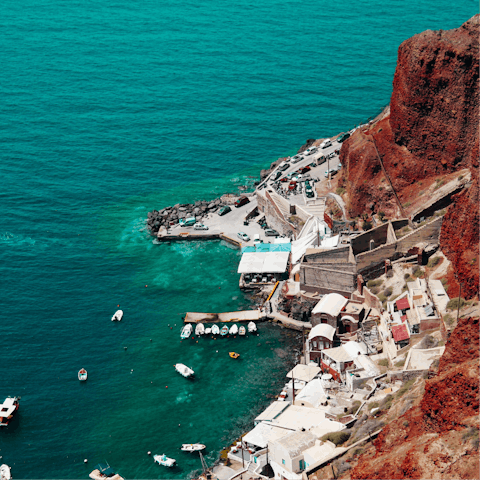 Explore the island of Santorini with its pebble beaches, vineyards and harbours