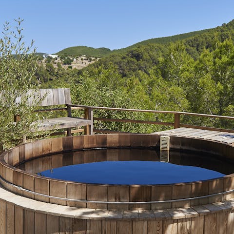 Unwind in the hot tub as you take in the stunning views