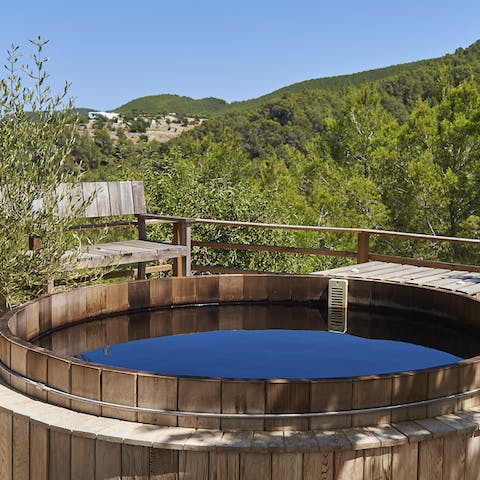 Unwind in the hot tub as you take in the stunning views