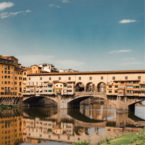 Visit the nearby Ponte Vecchio on the River Arno