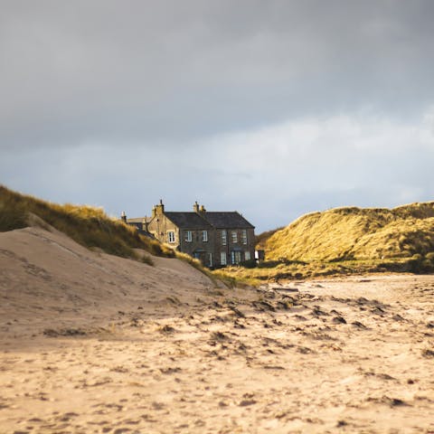 Take a coastal walk at Seahouses beach, a four-minute drive away