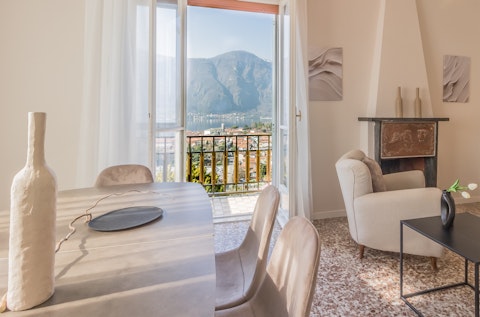 Dine with Lake Como and the mountains framed before you