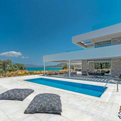 Take a dip in the pool or unwind with a book and a drink