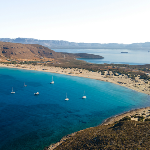 Swap your private beach for the rolling dunes of Simos Beach