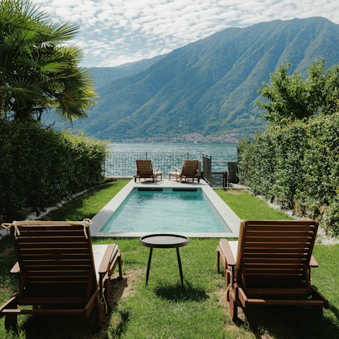 Take a refreshing dip in the pool with serene views across the lake