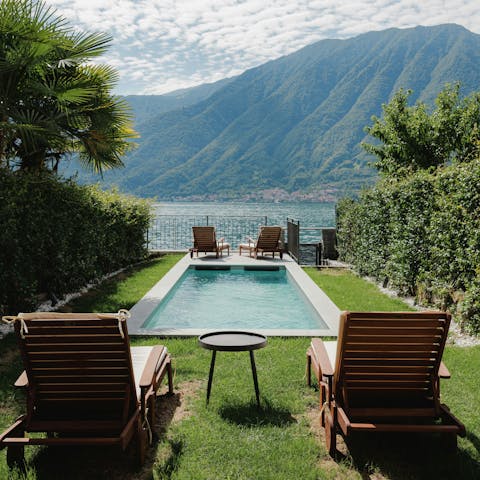 Take a refreshing dip in the pool with serene views across the lake