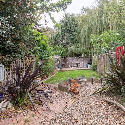 Pass some quality time in the home's leafy garden