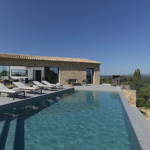 Lie back and relax on a lounger or splash about in the pool