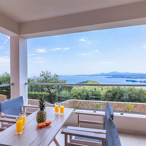 Take breakfast on the shaded terrace and look out over Corfu's coastline