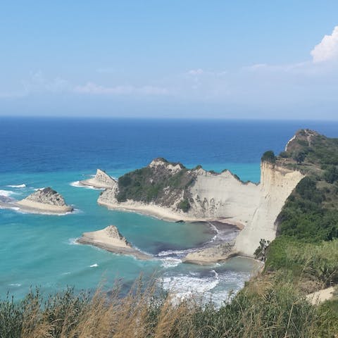 Explore the hidden beaches of Corfu's coast, just minutes away by car