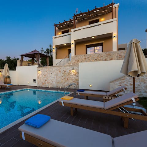 Relax on the loungers as you admire the modern architecture of your villa, cocktail in hand