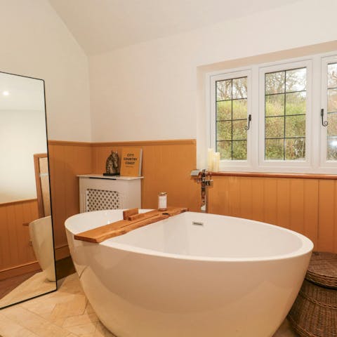 Enjoy a long soak in the main bedroom’s freestanding bath