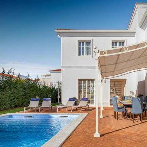 Sip freshly made lemonade beside your private pool