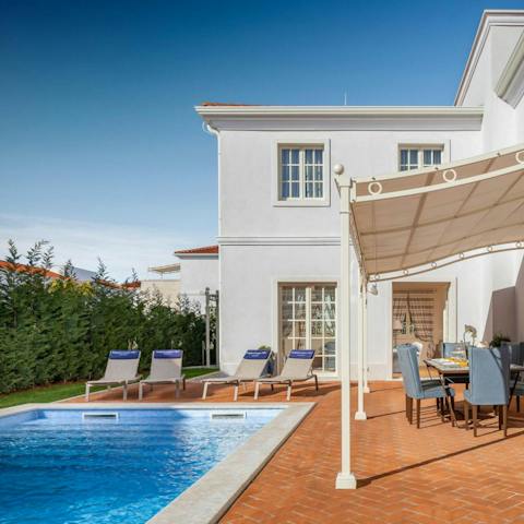 Sip freshly made lemonade beside your private pool