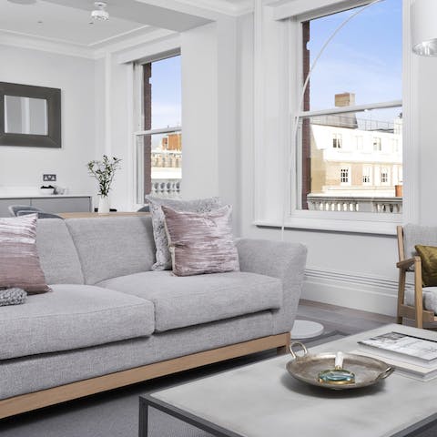 Put up your feet up after a long day in the light, bright living space