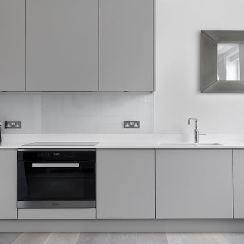 Cook at home in the sleek kitchen area