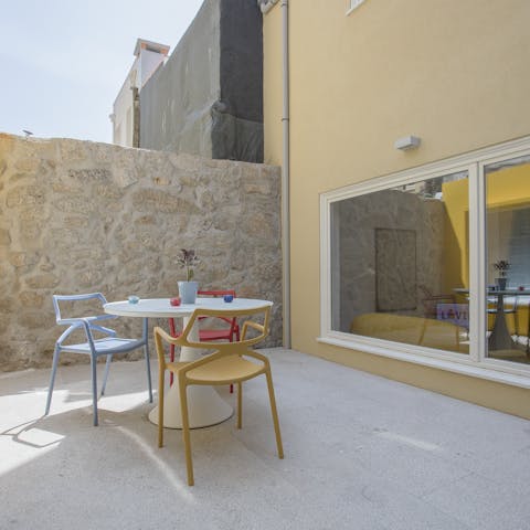 Unwind with a glass of wine on your colourful terrace