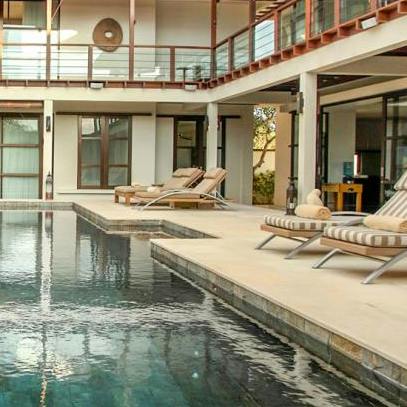 Lounge about by the pool, catching those tropical rays