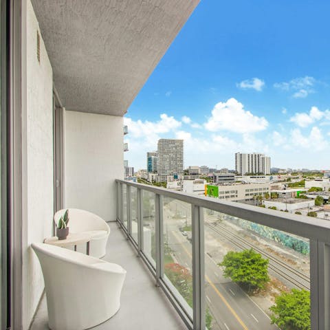 Take in the city view from the private balcony