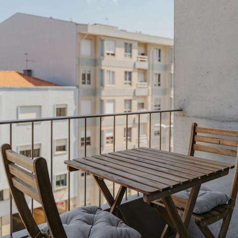 Relax on the balcony with a bottle of red wine