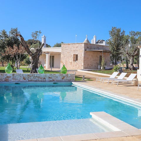 Relax by the pool while taking in the Mediterranean sun