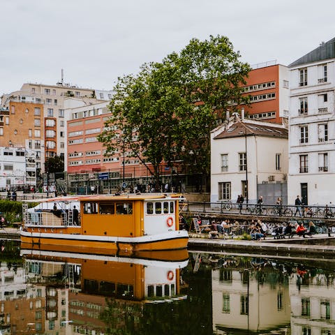 Enjoy a romantic stroll along the Canal Saint-Martin, six minutes away on foot