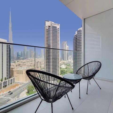 Drink in the city vistas from the private balcony