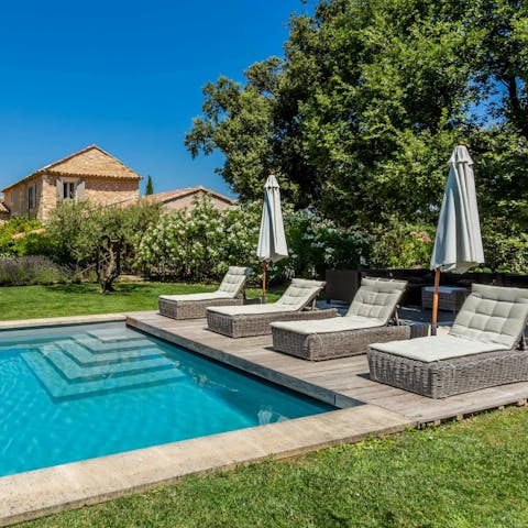 Soak up the sun poolside in the spacious garden