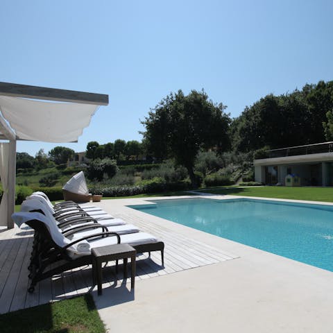 Spend long days laid out beneath cloudless skies and dips in the inviting pool