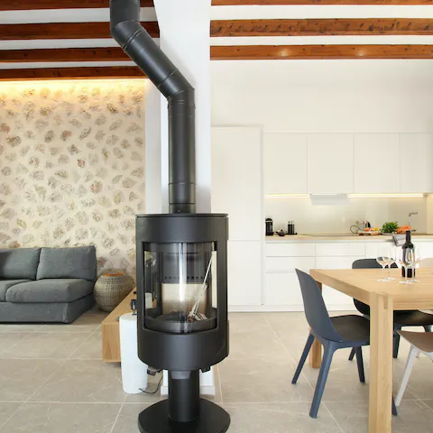 Cosy up by the wood burner when the Balearic weather turns chillier
