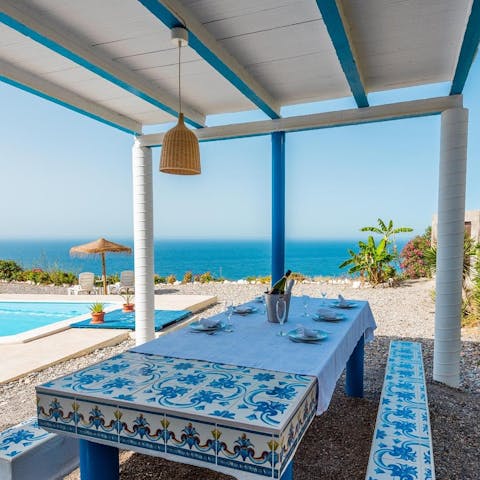 Prepare tapas to enjoy alfresco at this uniquely tiled table