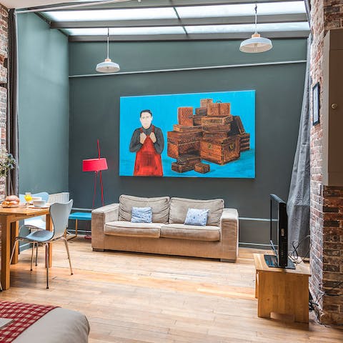 Sip a glass of wine in the chic living room, where a glass ceiling lets in plenty of light