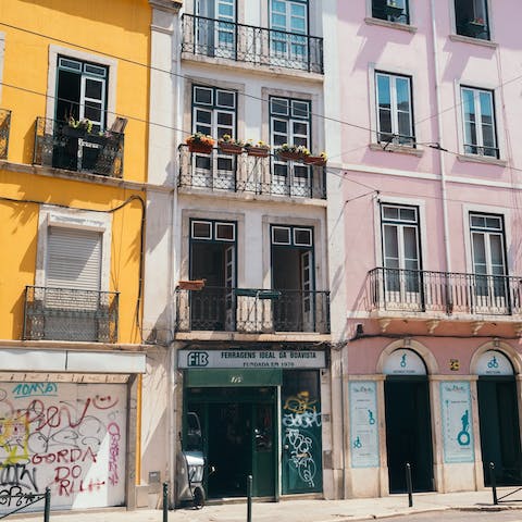 Explore the steep cobbled streets of bohemian Bairro Alto, a twenty-minute walk away