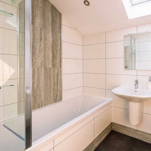 Relax in the bathtub with a glass of wine in hand